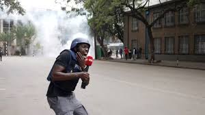 Police aim tear gas