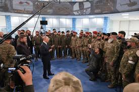 Putin inspects troops readying to fight Ukraine in surprise trip to Chechnya