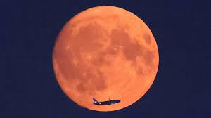 In pictures: Blue supermoon glows red.2024